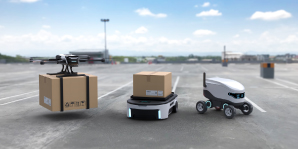 Image-of-automated-robot-carriers-and-robotic-arm-in-smart-distribution-warehouse-factory